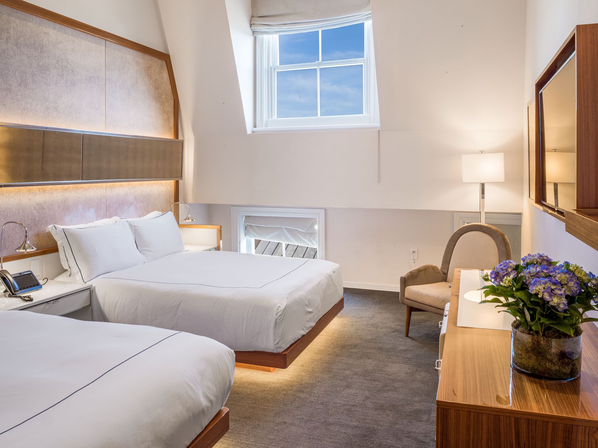 bedroom with two queen beds and large vaulted ceilings