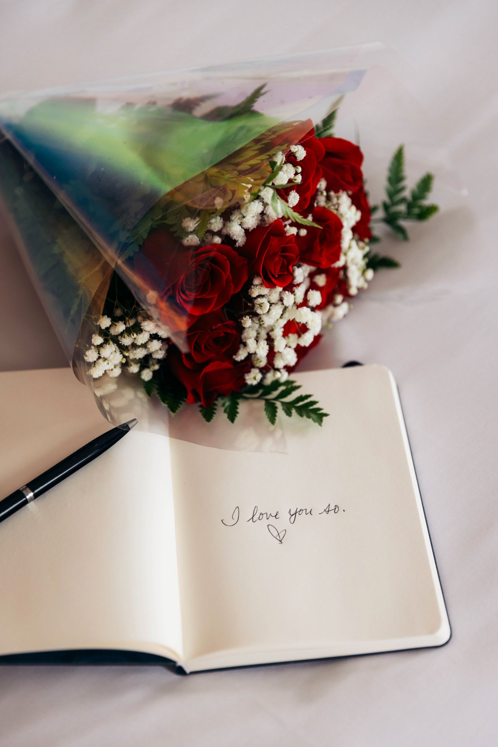 roses-notebook-lovenote-on-bed